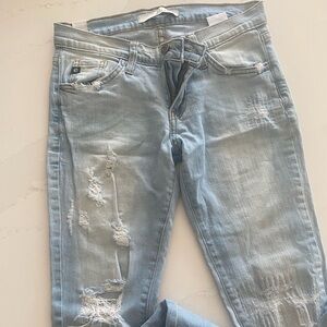 Skinny jeans with rips in knees and thigh area